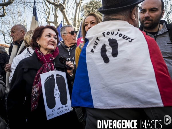 The Pieds-noirs protest outside the political rally of Emmanuel Macron