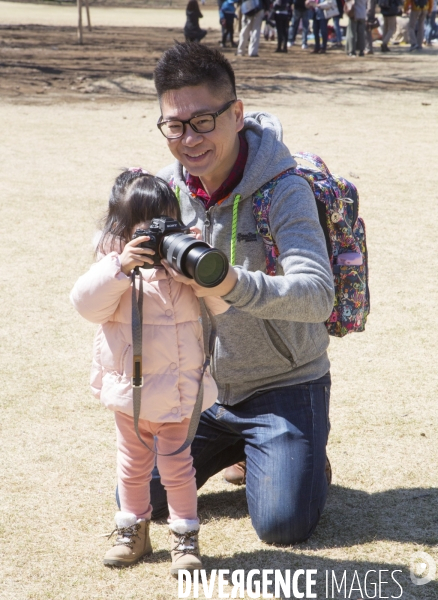 Un pere apprend la photo a sa fille a tokyo