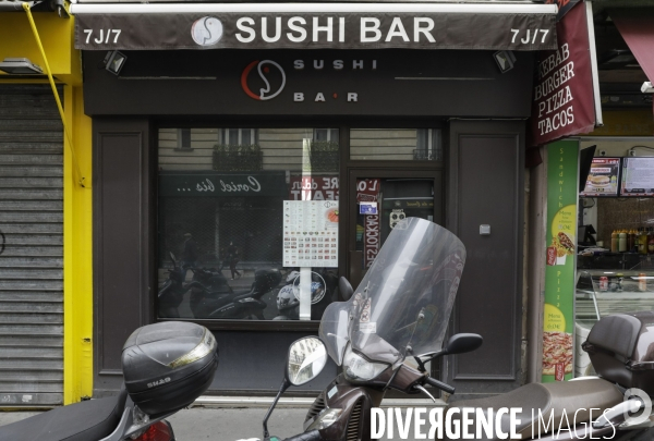 Magasins fermés la veille du premier jour de confinement rue de Belleville à Paris