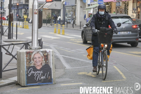 Marine le pen souhaite joyeux noel aux francais  a travers une affiche