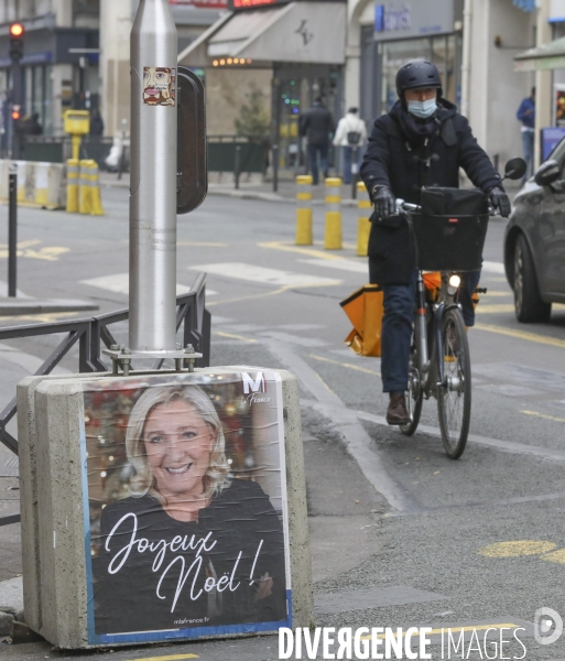 Marine le pen souhaite joyeux noel aux francais  a travers une affiche