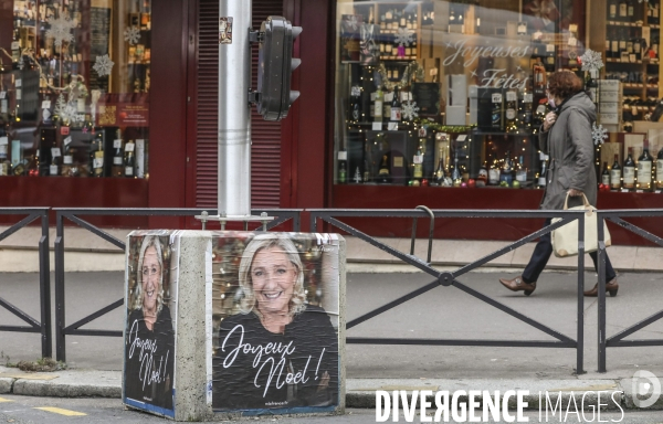 Marine le pen souhaite joyeux noel aux francais  a travers une affiche