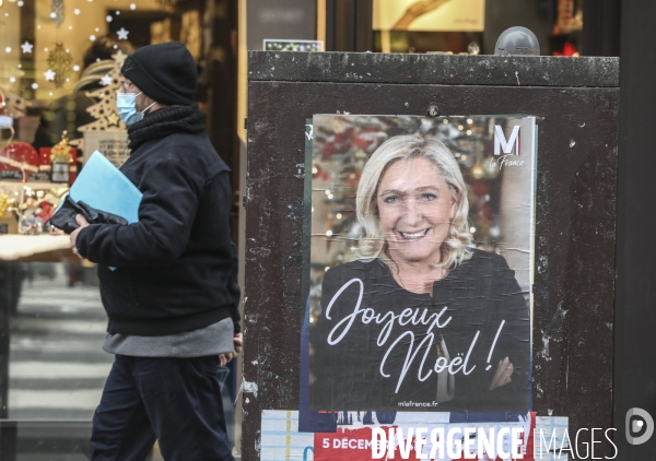 Marine le pen souhaite joyeux noel aux francais  a travers une affiche