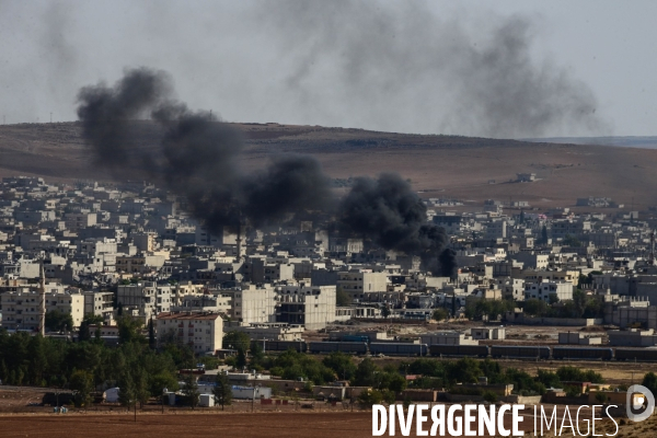 Combat in Kobani, Turkey-Syria Border. Combat dans Kobané, Frontaliers entre Syrie et Turquie.